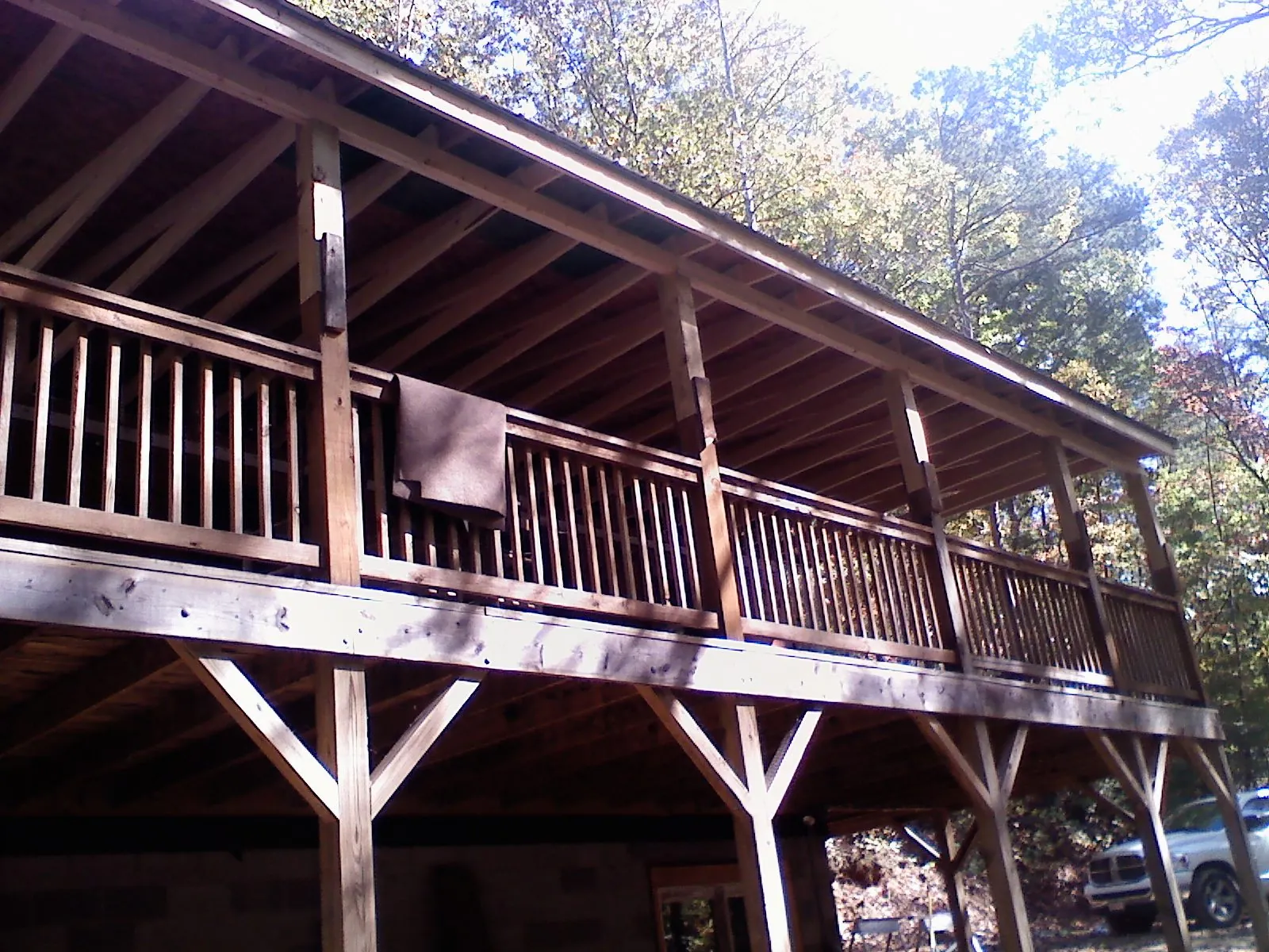 Timber framing under a new elevated porch and deck — Roof Leak Repair in Harper Woods by Roofing Brothers